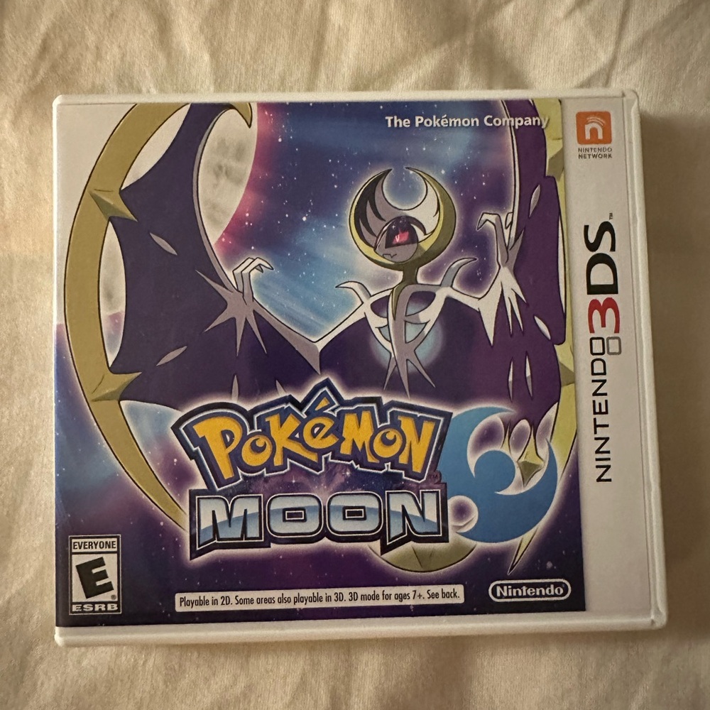 Nintendo 3DS Pokémon Moon Game Black and Blue